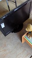 Front angled view of the 32-inch LG flat screen TV showing the screen and base stand.
