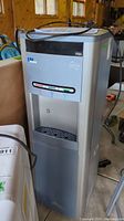 Overview of the Pura Ultimate bottle-less water cooler dispenser showing full unit including drip tray and control buttons