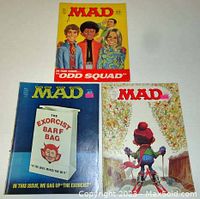 Three MAD Magazine covers from the June 1969, October 1974, and March 1975 issues