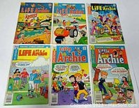 6 Archie comic books laid out in two rows, featuring 'Life With Archie' and 'Little Archie' series with colorful covers and classic characters.