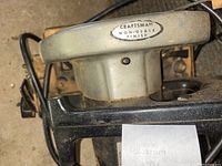 Close-up of Craftsman saw handle with non-glare finish label