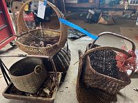 Multiple dark wicker baskets grouped together showing size variation and basket styles
