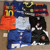 All nine items laid out in three rows on carpet