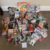 Full view of the Ty Beanie Babies collection, mostly in original packaging with a Ty Official Membership Kit box included.