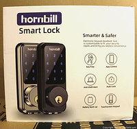 Box front showing Hornbill Smart Lock with product image, brand name, and key features including key free, app control, anti-theft alert, auto-lock, battery backup, and touchscreen keypad.