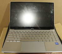 Front view of LHMZNIY A9 laptop showing keyboard, trackpad, webcam and screen.