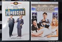 Photo of two DVD cases side by side showing front covers of The Producers 1967 and 2005 films.