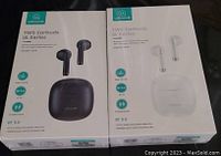 Photo of two unopened boxes of USAMS TWS Earbuds IA Series, one black and one white, showing front packaging with product image and specs.