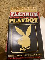 Five magazines stacked showing cover pages including Playboy 30th Anniversary and Spectrum 25th Anniversary issues