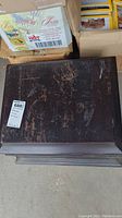 Top view of wooden cabinet showing scratches and wear marks.