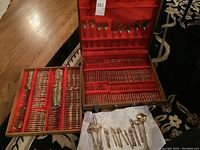 Removable tray and wood case opened, showing two separate trays of flatware.