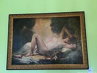 Front view of framed painting showing reclining nude and ornate frame
