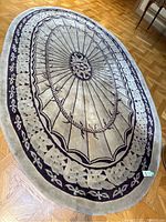 Top-down view showing full oval shape and central medallion and border design