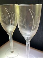 Pair of flutes front view on lighted surface