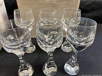 Front view of six glasses in original Baccarat box