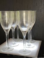 Front view showing all six etched crystal flutes grouped together