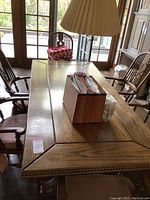 Full view of 84" solid oak table with six chairs and top items (not included)
