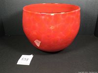 Front view of the red patterned art glass bowl
