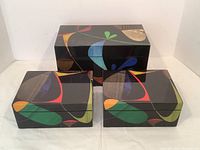 Three lacquered wood boxes (one large, two small) displayed together on white background