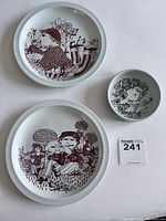 Top view of 2 plates and 1 small bowl showing detailed brown monochrome illustrations on white ceramic background