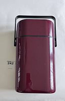 Maroon insulated wine chiller with black handle, vertical orientation.