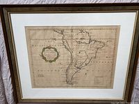 Full view of framed map showing mat and gold‐trim wood frame