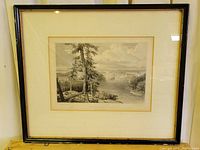 Framed antique print showing entire framed artwork with cream mat and dark wood frame.