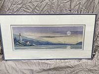 Full view of framed print on backdrop