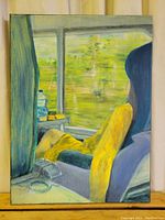 Full front view of the oil on canvas painting showing the girl seated inside train looking out the window.