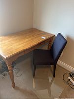 Angled view of desk and chair showing overall lot setup.