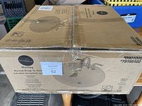 Box of Project Source Morley round drop-in sink with image of the sink printed on the box showing round shape and faucet holes.