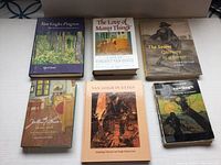 Six books laid out flat showing covers related to Vincent Van Gogh art and life