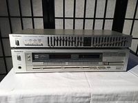 Both Technics stereo receiver and stereo graphic equalizer stacked, showing front panels and overall condition.