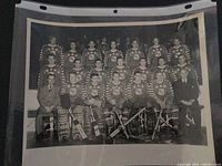 Full team posed group photo from the 1948 NHL All-Star Game including star players and coaches in team uniforms and suits.