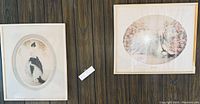 Three framed Louis Icart prints on a wood-paneled wall, one missing glass, one frame damaged