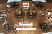 Overview of 12 place settings on table with cups, plates, saucers