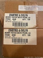 Two brown cardboard boxes labeled Crabtree & Evelyn Berry Patch Bath Pearl LG with batch number 25914 containing 120 bath pearls each.