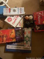 Various boxed holiday lights and decorative items including GE Classic Lights, LED snowflake lights, and biblic lighting