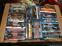 All Blu-ray spines arranged in cardboard box, overview of contents