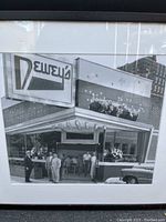 Framed vintage black-and-white photo print showing exterior of Dewey's Diner with people outside and vintage car.