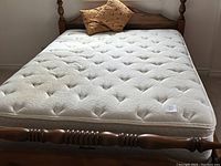 Full view of queen bed frame and mattress