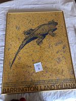 Full view of framed Barrington Land Iguana poster showing the entire iguana and text at the bottom in a yellow speckled background.