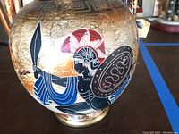 Side of urn showing soldier in red helmet with spear and blue garment