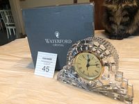 Waterford Crystal quartz mantle clock with original box, placed on a table.