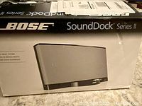 Bose SoundDock Series II speaker dock in its original box, showing the model name and design
