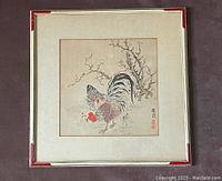 Full view of vintage Japanese rooster print in cream wooden frame with raised red corners and delicate gilt trim.