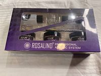 Front view of Rosalind Professional Acrylic System box showing three acrylic powder jars and other accessories inside clear window packaging.