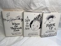 Three hardcover books by Shel Silverstein with dust jackets: Where the Sidewalk Ends, A Light in the Attic, Falling Up.