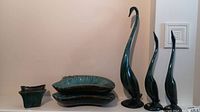 Six glazed pottery items including three bird figures and three planters or ashtrays with blue-green glaze