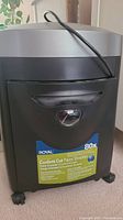 Front view of the black and gray Royal paper shredder showing the brand label and wheels at the base.